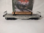Lionel 6111 Light Gray Flat Car With 3 Log Load. Fixed Price $13.79.