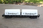 American Flyer 24575 Gauge Flatcar With Borden Milk Containers. Fixed Price $23.00.