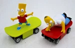 2PC 12V Micro Scalextric Slot Car Bart & Homer Simpson Tv Skate Boards. Fixed Price $84.15.