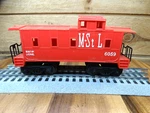 Lionel Gauge M. St. 6059 Caboose With Operating Coupler. Fixed Price $15.00.