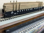 Northern Pacific - 65 Ft Drop End Mill Gondola W/ Resin Pole Load Ho Scale New. Fixed Price $76.95.