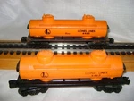 Two Lionel 6465 Lines Orange Tank Cars. Fixed Price $19.99.