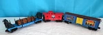 Lionel Lines Lighted Red Caboose, Catalog Cover Boxcar, Flatcar W/ Logs, Scale. Fixed Price $35.99.
