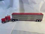 1/64 Scale Kenworth Day Cab And Sleeper Truck With Cattle Trailer. Fixed Price $110.00.