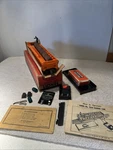 Lionel Postwar 3562-75 Late Orange Barrel Car. Fixed Price $299.99.