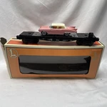 Lionel 6-36067 O-gauge Flatcar With Die-cast 1955 Pink Cadillac. Fixed Price $22.50.