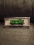 Atlas 3565 N-scale Burlington Northern Caboose #9931. Fixed Price $15.00.