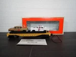 Lionel Gauge Circle-l Racing Flatcar With Stock Load 6-19423. Fixed Price $30.00.