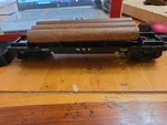 Lionel Operating New York Central Dump Car 6-16604 W/tray & Logs. Fixed Price $14.55.