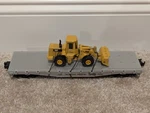 Lionel 6 17517 Western Pacific Flatcar W/ Ertl Cat 950F Loader Boxed. Fixed Price $45.00.