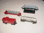 4-LIONEL Freight Cars 0-027. Fixed Price $39.95.