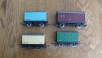 4 Tri-ang Oo Gauge Wagons. 1 Horsebox, 2 Insulfish & Green Wagon.. Fixed Price $40.00.