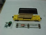Lionel Gauge Yellow Santa Fe Dump Car Atsf #16715 With Logs & Track. Fixed Price $25.00.