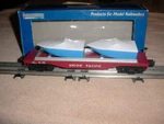 Industrial Rail Flat Car # 50055 , Union Pacific W/boat Load 0-027 Ga.. Fixed Price $25.00.
