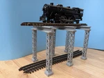 Trestles For Elevated Train Scale Atlas 3-RAIL Package Of Light Gray. Fixed Price $30.00.