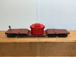 Lionel 6-9233 Brown Diecast Depressed Center Machinery Car #9233 With Load. Fixed Price $49.00.