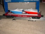 Industrial Rail Flat Car # 50055 , Union Pacific W/boat Load 0-027 Ga.. Fixed Price $25.00.