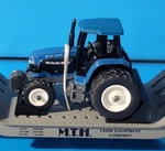 CB27: Mth Rail King No. 30-7611 Flat Car W/ Ertl Tractor #22893 Ln Unrun. Fixed Price $22.95.