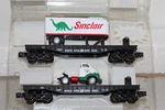 Menards 2-PIECE 10-1/2" O Gauge Bn Flatcar With 1954 Gmc Sinclair Traiier. Fixed Price $64.95.