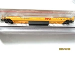 Atlas # 50007048 Ttx 53' Rebuilt Well Car (yellow). 471617 N-scale. Fixed Price $35.95.